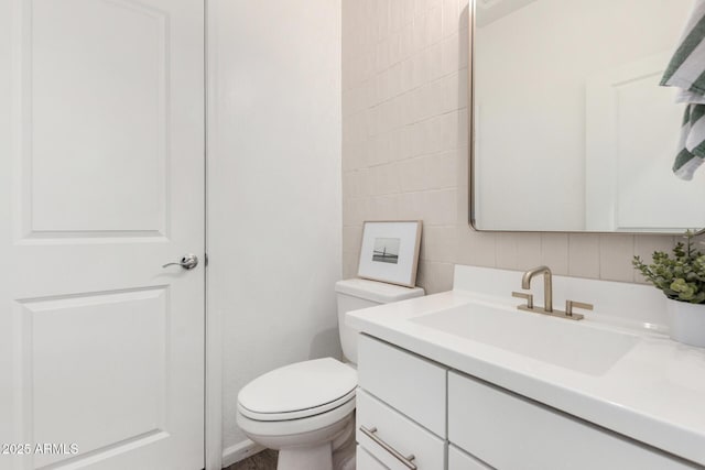 9418 W Minnezona Ave, Phoenix, AZ 85037 - bathroom featuring vanity, tile walls, toilet, and tasteful backsplash