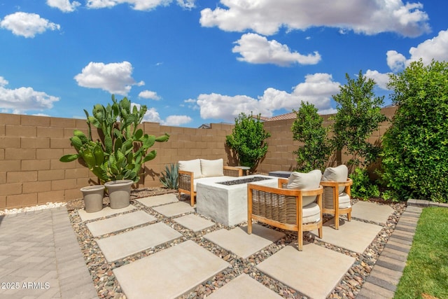 9418 W Minnezona Ave, Phoenix, AZ 85037 - fenced backyard featuring a fire pit and a patio