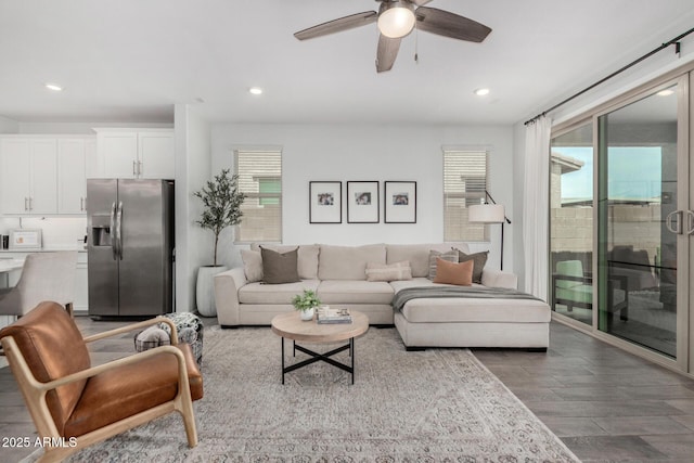 9418 W Minnezona Ave, Phoenix, AZ 85037 - living room featuring ceiling fan, wood finished floors, plenty of natural light, and recessed lighting