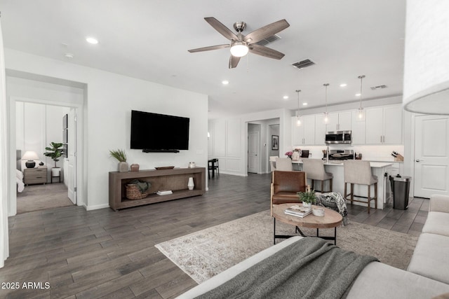 9418 W Minnezona Ave, Phoenix, AZ 85037 - living area featuring a ceiling fan, dark wood finished floors, and recessed lighting