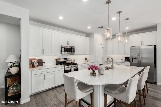 9418 W Minnezona Ave, Phoenix, AZ 85037 - kitchen featuring stainless steel appliances, white cabinetry, a sink, and recessed lighting