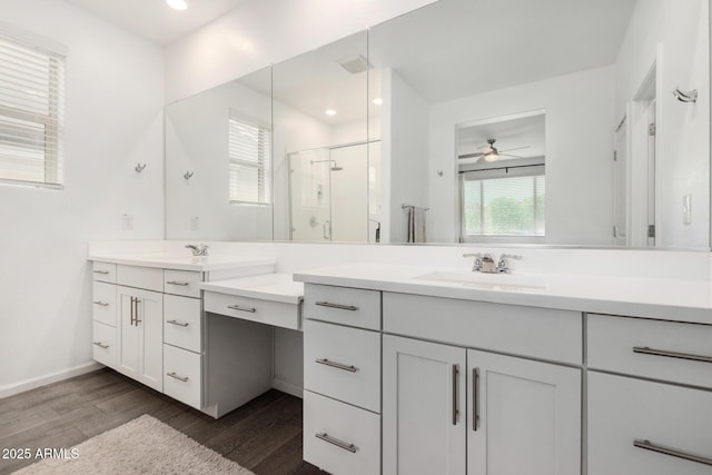 9418 W Minnezona Ave, Phoenix, AZ 85037 - full bath with a shower stall, wood finished floors, ceiling fan, vanity, and recessed lighting