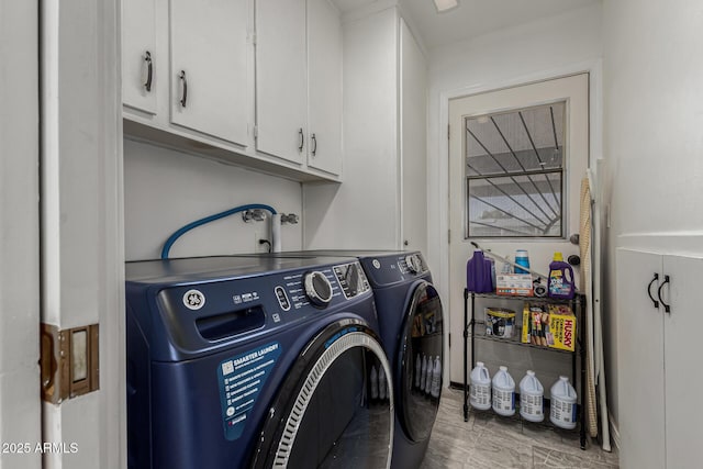 laundry area featuring independent washer and dryer and cabinets