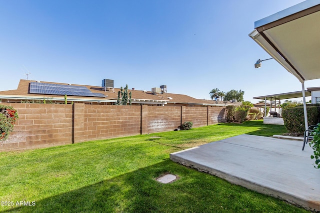 view of yard featuring central AC unit and a patio