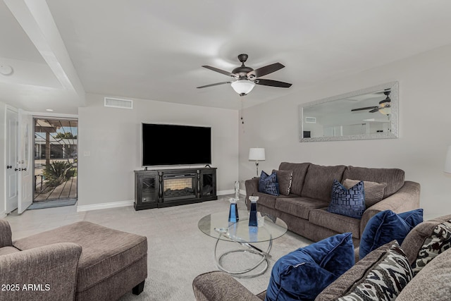 living room featuring ceiling fan and light colored carpet