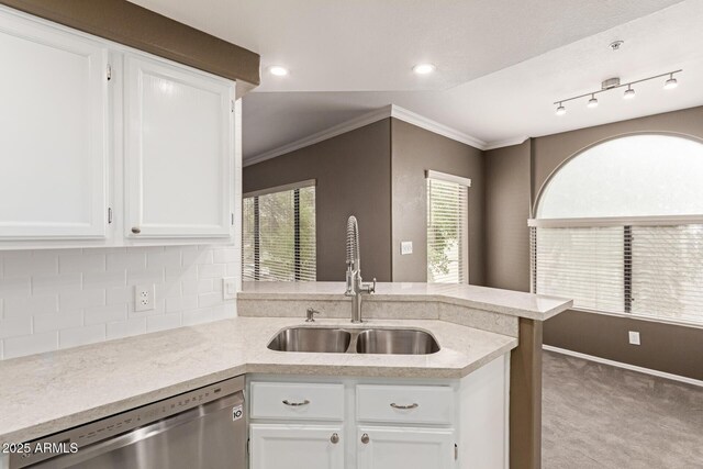 750 E Northern Ave E Unit 2145, Phoenix, AZ 85020 - kitchen featuring stainless steel dishwasher, a sink, a peninsula, carpet flooring, and white cabinets