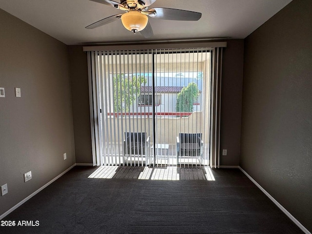 750 E Northern Ave E Unit 2145, Phoenix, AZ 85020 - spare room featuring dark colored carpet, ceiling fan, and baseboards
