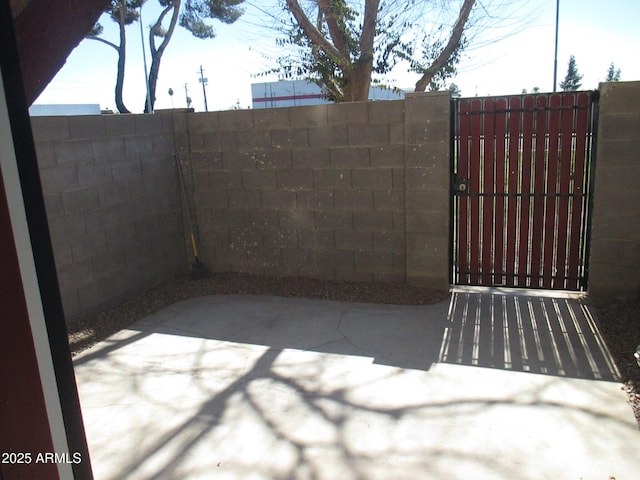 view of gate featuring fence