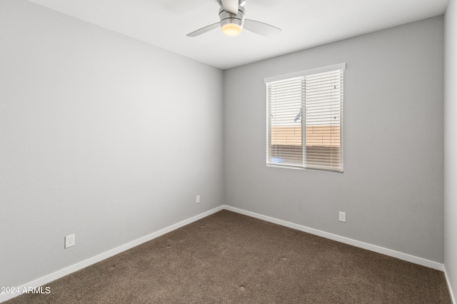 empty room with ceiling fan and carpet flooring