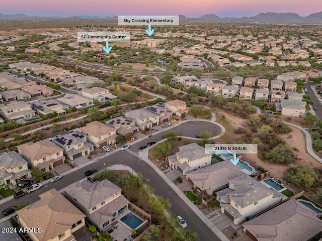 aerial view at dusk with a mountain view