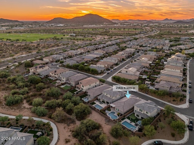 aerial view at dusk with a mountain view