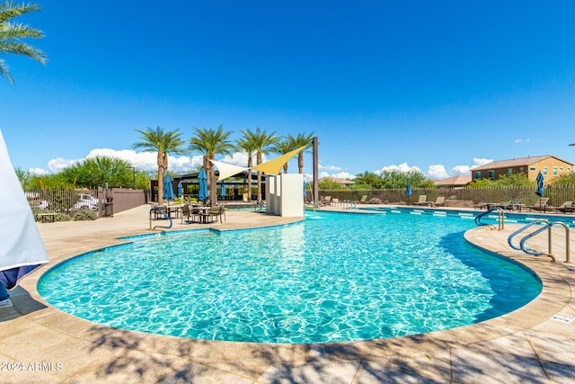 view of pool featuring a patio