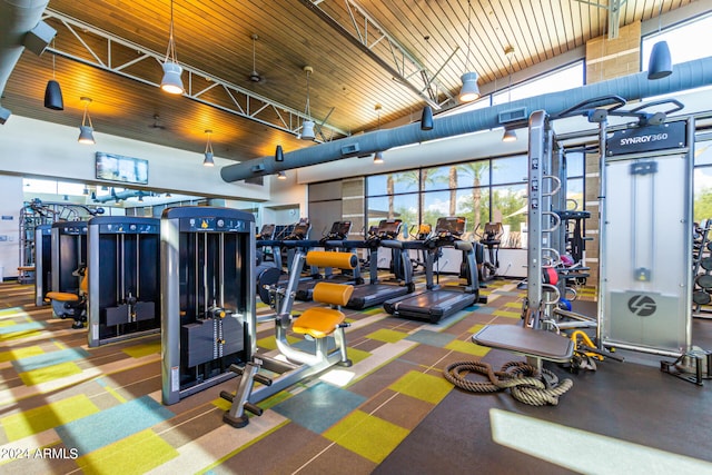 gym featuring wooden ceiling and lofted ceiling