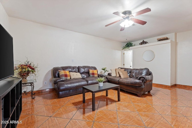 living room featuring a ceiling fan