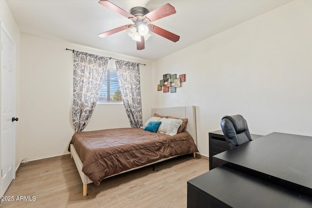 bedroom featuring ceiling fan and light wood-style flooring