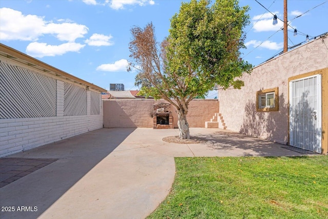 view of yard with a patio and fence