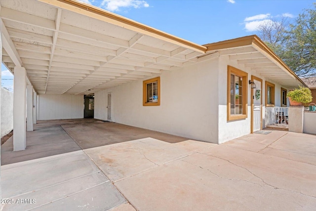 view of patio / terrace with an attached carport