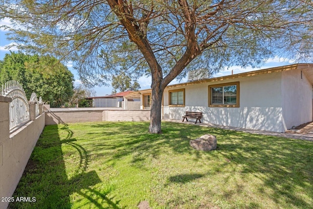 view of yard featuring a gate and fence