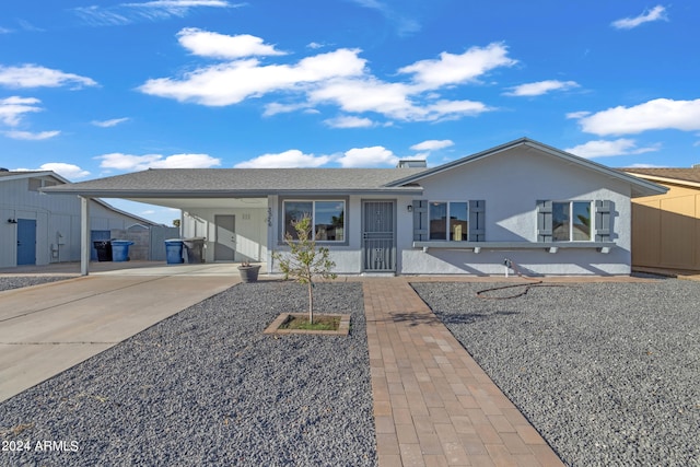 view of front of home with a carport