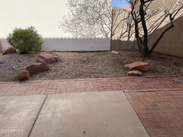 view of yard with a patio area and fence