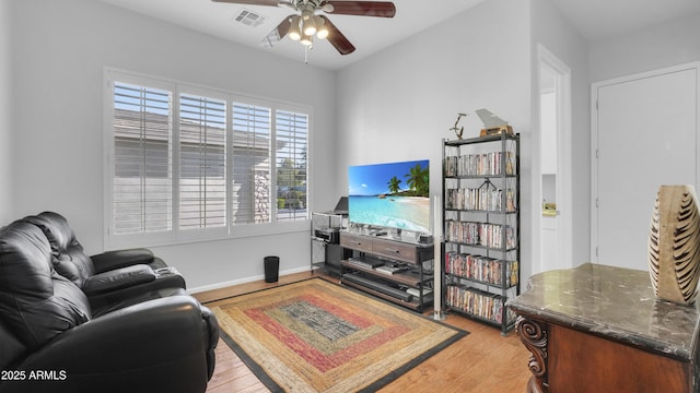 4276 E Meadowview Dr, Gilbert, AZ 85298 - living area featuring a ceiling fan, baseboards, visible vents, and light wood-style floors