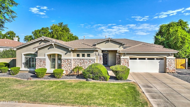 4276 E Meadowview Dr, Gilbert, AZ 85298 - view of front of house with an attached garage, stucco siding, and stone siding