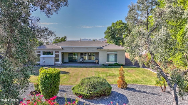 4276 E Meadowview Dr, Gilbert, AZ 85298 - rear view of property featuring a lawn, stucco siding, a tile roof, and a patio
