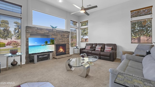 4276 E Meadowview Dr, Gilbert, AZ 85298 - carpeted living room featuring ceiling fan, visible vents, baseboards, and a fireplace