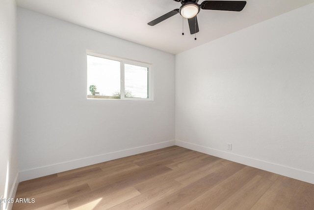 unfurnished room featuring light wood-style flooring and baseboards