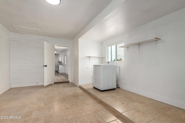 laundry room with light tile patterned floors, laundry area, baseboards, washer / clothes dryer, and attic access