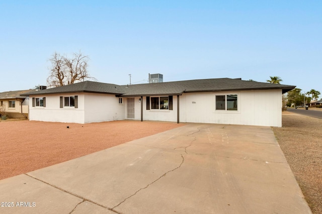 ranch-style home featuring central AC, a patio, and driveway