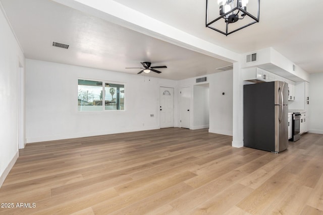 unfurnished living room featuring baseboards, visible vents, ceiling fan, and light wood finished floors