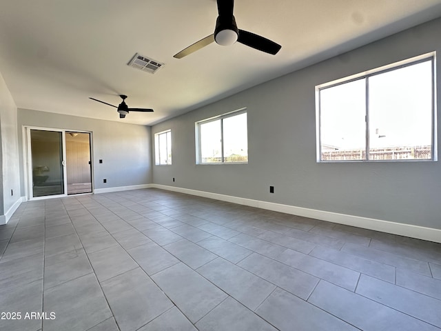 5924 W Tierra Buena Ln, Glendale, AZ 85306 - empty room with ceiling fan, tile patterned flooring, and baseboards