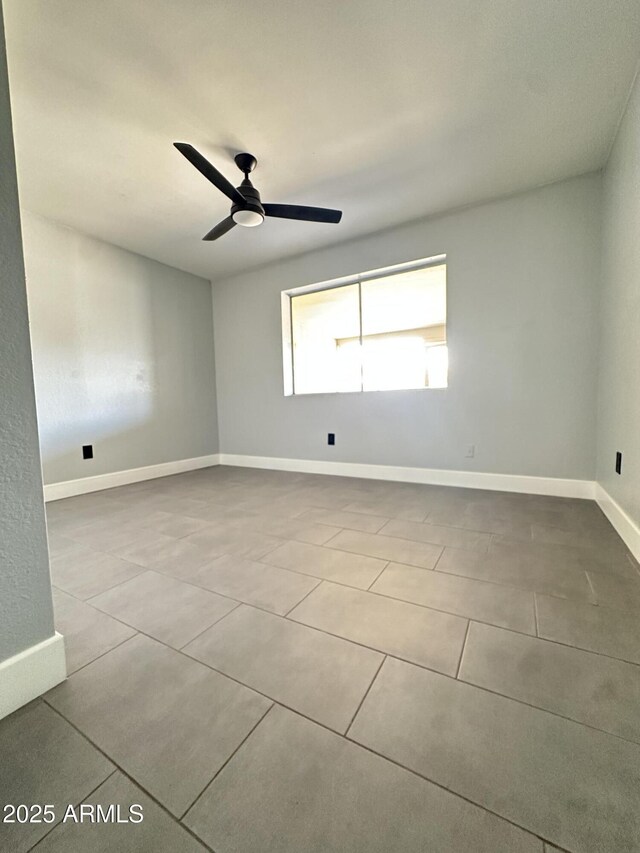 5924 W Tierra Buena Ln, Glendale, AZ 85306 - tiled spare room with a ceiling fan and baseboards
