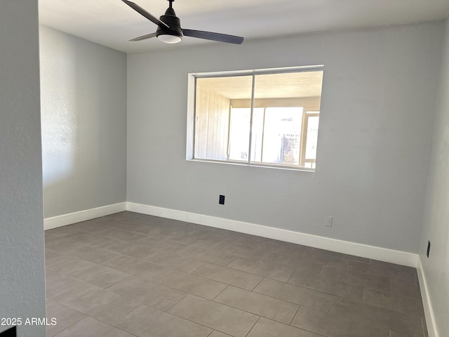 5924 W Tierra Buena Ln, Glendale, AZ 85306 - spare room with ceiling fan and baseboards