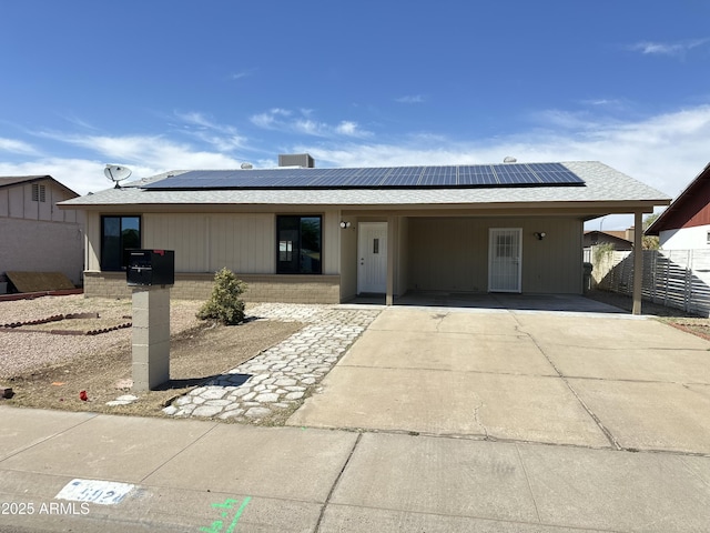 5924 W Tierra Buena Ln, Glendale, AZ 85306 - single story home featuring roof mounted solar panels, an attached carport, fence, driveway, and a shingled roof