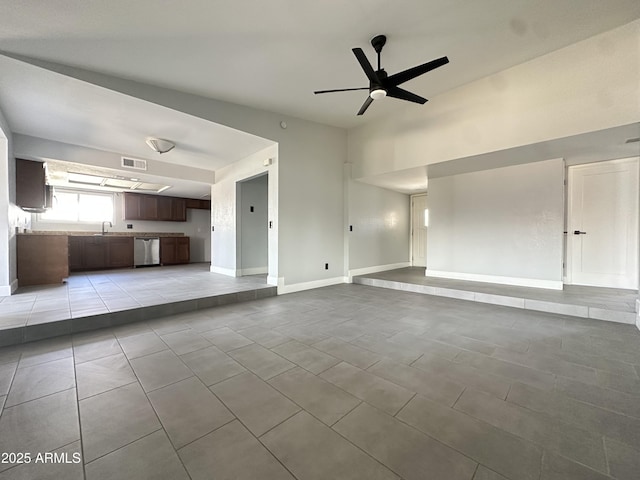 5924 W Tierra Buena Ln, Glendale, AZ 85306 - unfurnished living room featuring light tile patterned flooring, ceiling fan, and baseboards