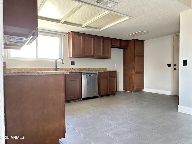 5924 W Tierra Buena Ln, Glendale, AZ 85306 - kitchen with dishwasher, light tile patterned floors, baseboards, a textured ceiling, and a sink