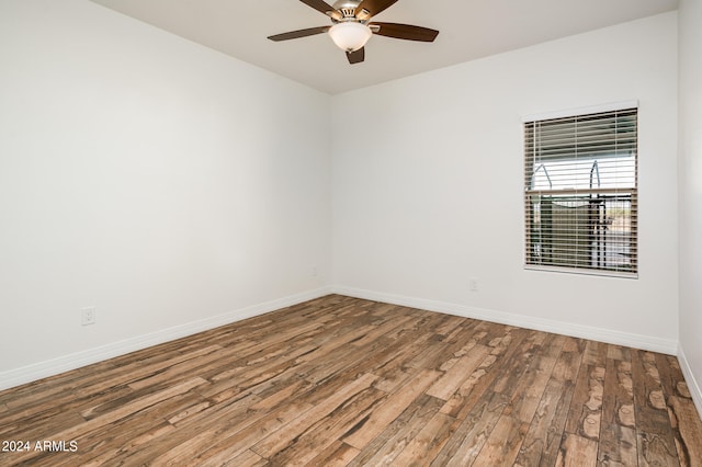 unfurnished room with hardwood / wood-style floors and ceiling fan