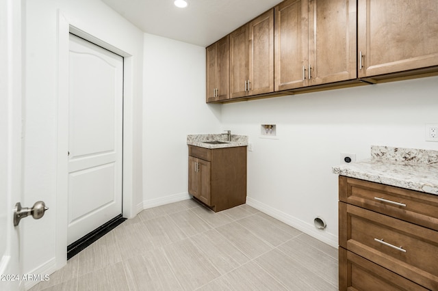 laundry room featuring cabinets, hookup for an electric dryer, and hookup for a washing machine