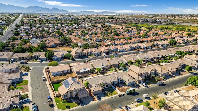 birds eye view of property with a mountain view