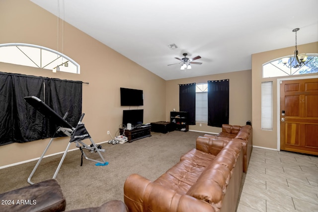 living room featuring ceiling fan with notable chandelier, light carpet, and high vaulted ceiling