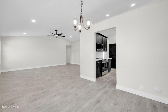 unfurnished living room with ceiling fan with notable chandelier, light wood-type flooring, and lofted ceiling