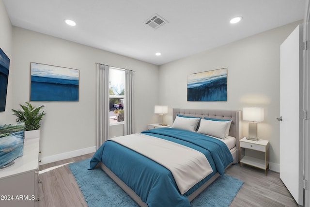 bedroom with light wood-type flooring