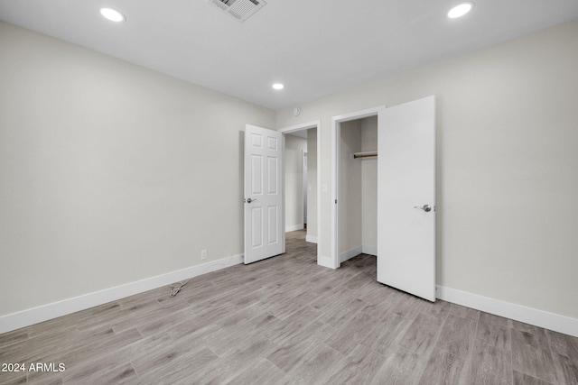 unfurnished bedroom with light hardwood / wood-style flooring