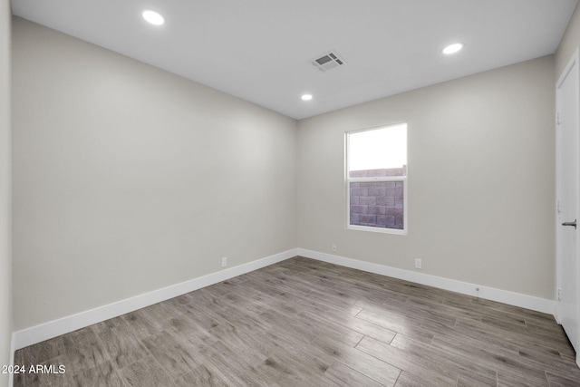 spare room with light hardwood / wood-style flooring