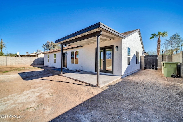 rear view of house with a patio and french doors