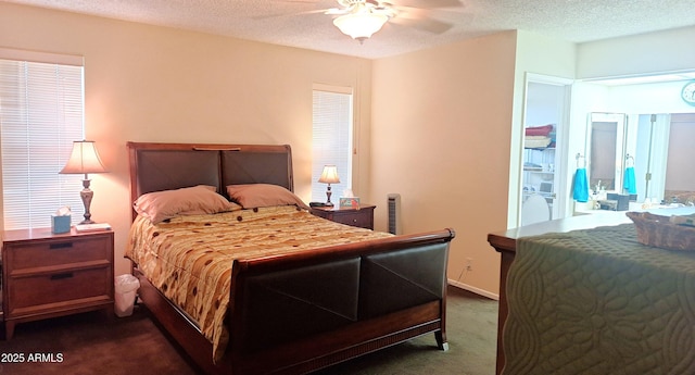 bedroom featuring baseboards, ceiling fan, dark carpet, and a textured ceiling