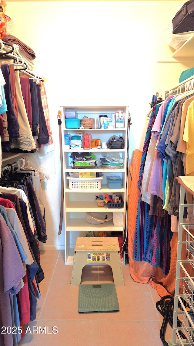 spacious closet with tile patterned flooring