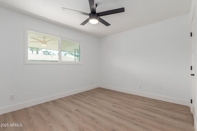 empty room featuring light wood-style floors, baseboards, and ceiling fan